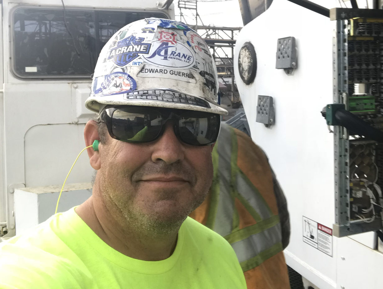 Crane expert witness reviewing lift planning documents and job site conditions